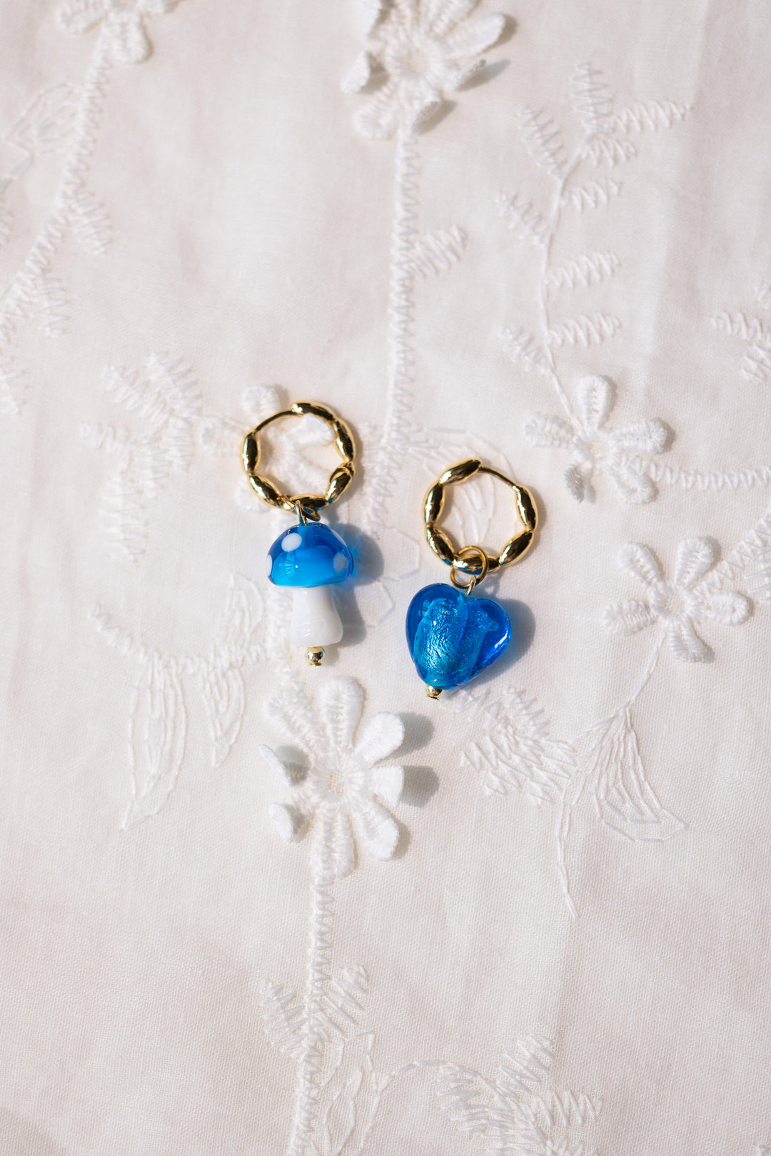 Blue glass heart and mushroom earrings