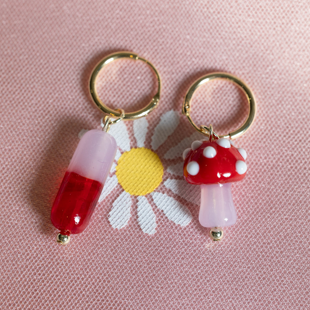 Red capsule and mushroom earrings